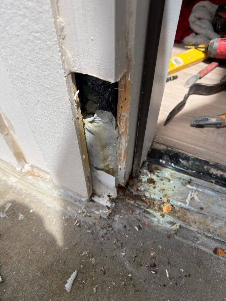 View of Improper Flashing Installation at Exterior Wall & Door Jamb