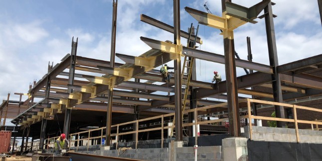 Tnemec’s Aerolon Applied at Structural Steel Canopy Framing – Extending Out at Exterior and through to the Interior Steel